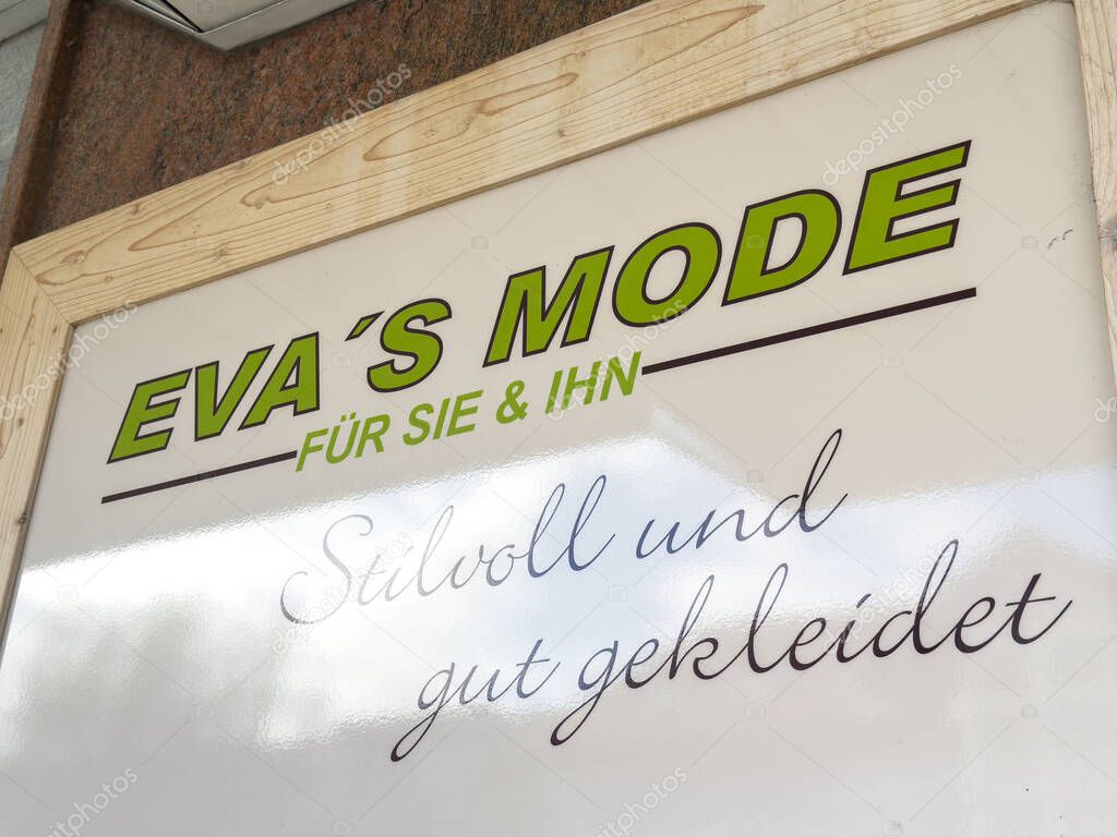 Althofen, Austria - September 17, 2025: Eva's Mode sign highlights fashionable clothing for men and women, featuring a modern design and vibrant colors