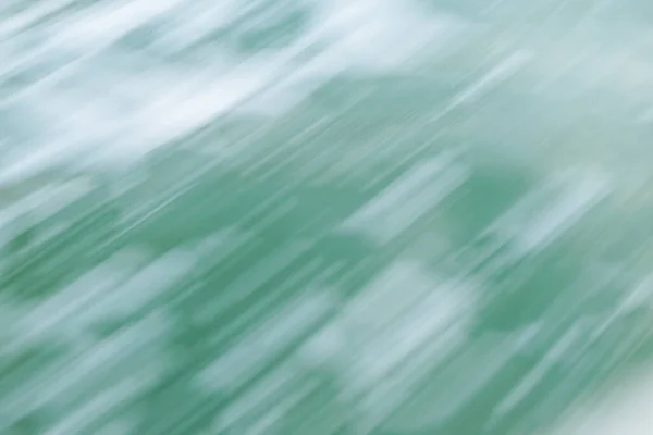 Deniz köpüğü yeşili tonlarda soyut hareket bulanıklığı.