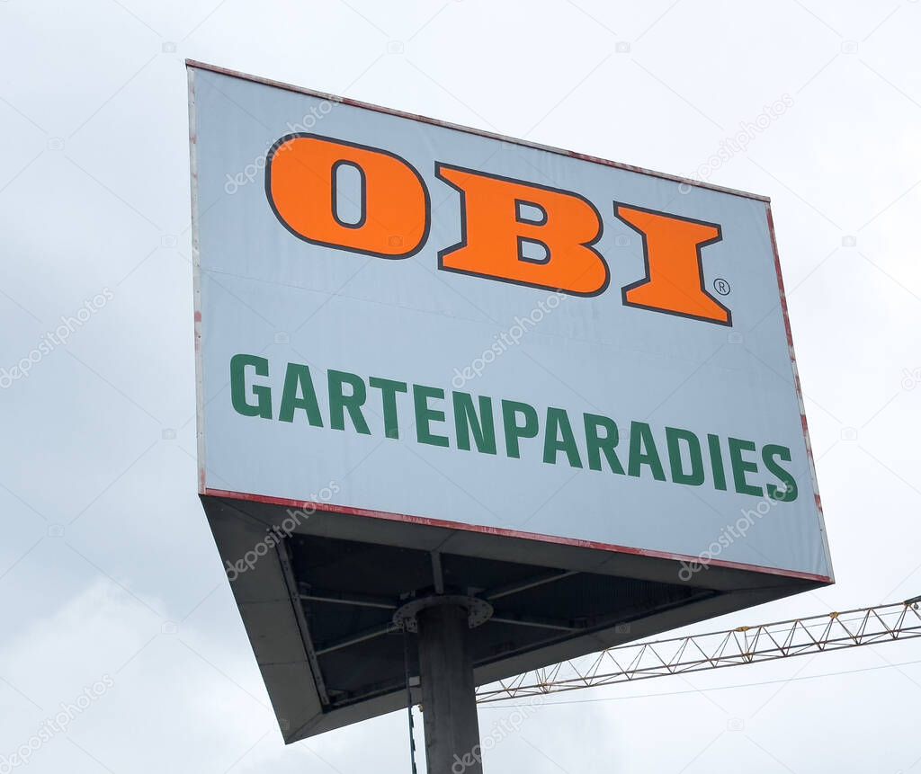 Villach, Austria - October 23, 2025: OBI Gartenparadies sign stands tall against a cloudy backdrop, emphasizing gardening and outdoor lifestyle branding