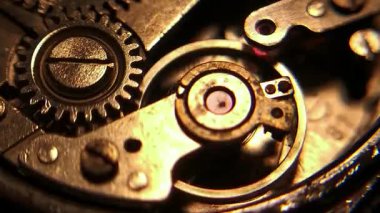 Close-up macro footage showing the internal mechanical movement of an automatic wristwatch, including gears, balance wheel, springs, and metal textures. Ideal for engineering, technology, craftsmanship, and time-related concepts.