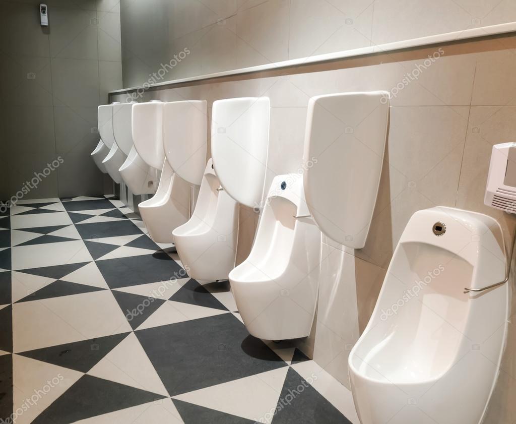 Men's room toilet urinal multiple — Stock Photo ©