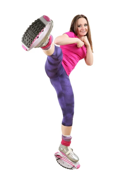 Ragazza sportiva in scarpe per il salto kangoo — Foto Stock