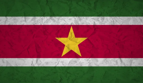 Bandera de Surinam con el efecto de papel arrugado y grunge — Vector de stock