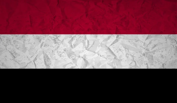 Bandera de Yemen con el efecto de papel arrugado y grunge — Vector de stock