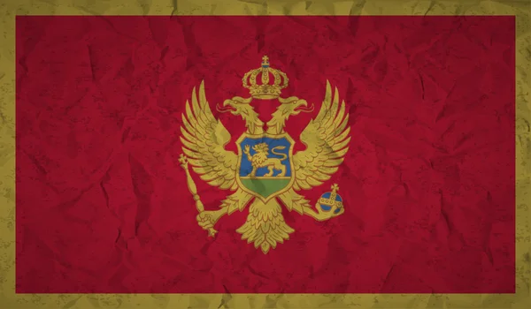 Flaga Czarnogóry z efektem zmięty papier i grunge — Wektor stockowy
