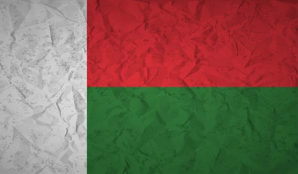 Bandera de Madagascar con el efecto de papel arrugado y grunge — Vector de stock