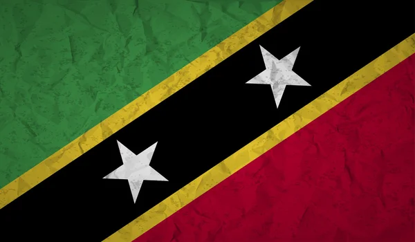 Saint Kitts vlag met het effect verfrommeld papier en grunge — Stockvector