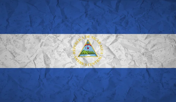 Nicaragua Flag with the effect crumpled paper and grunge — Stock Vector