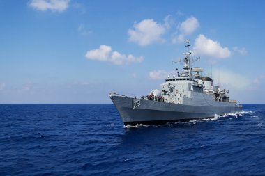 warship drives in mediterran sea clipart