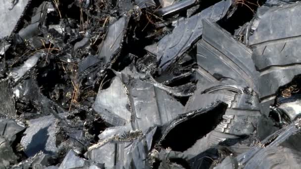 Shredded car tires pile for recycling. Close-up, tilt. — Stock Video