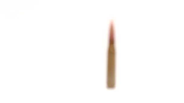 AK-47 ammunition. Defocus from the foreground on a single upright bullet. — Stock Video