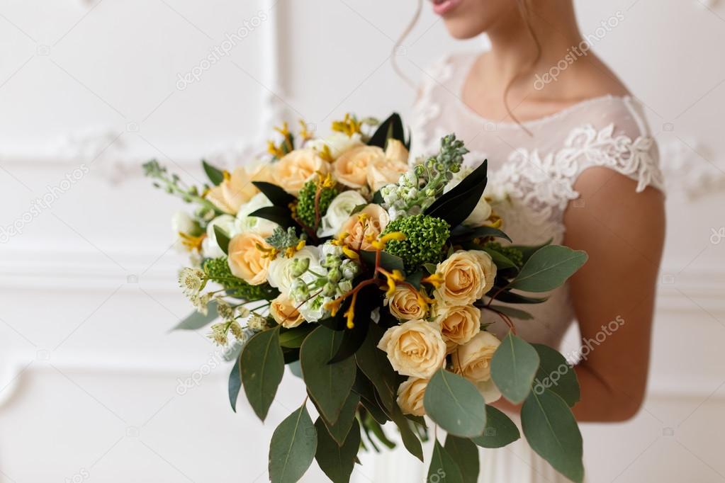 Bride Holding A Bouquet Of Flowers In Rustic Style Wedding Stock Photo Bride Holding A Bouquet Of Flowers In Rustic Style Wedding Stock Photo
