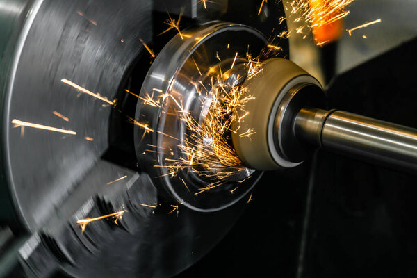 External grinding of a part with an end wheel on a circular grinding machine.