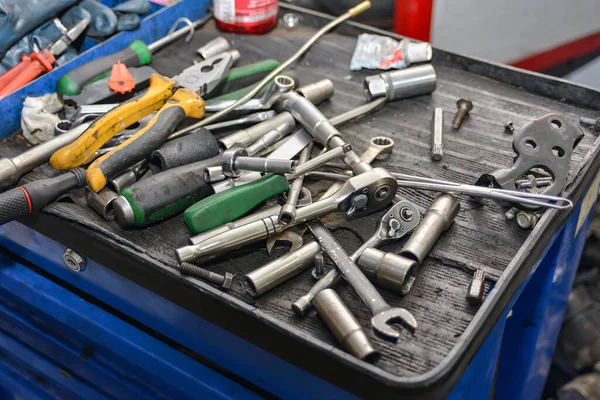 Locksmith\'s wrenches, screwdrivers and heads are in a repair box at a workshop. Tool in a car workshop.