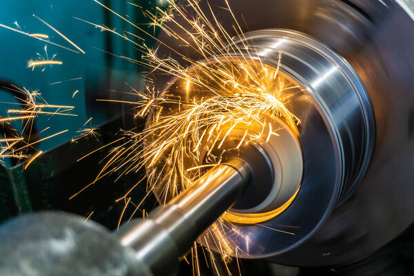 Internal grinding of a part with a face abrasive wheel on a circular grinding machine.