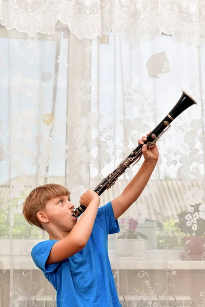 Boy Blue Clothes Plays Clarinet Holds — Fotografia de Stock