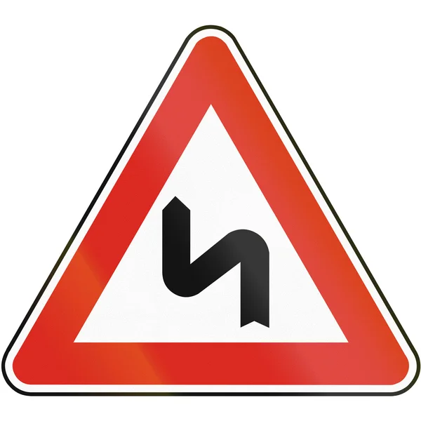 Straßenschild in der Slowakei - Doppelkurve, zuerst nach links — Stockfoto