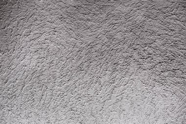 Boyalı bir duvarın kabaca şekillendirilmiş yüzeyi .