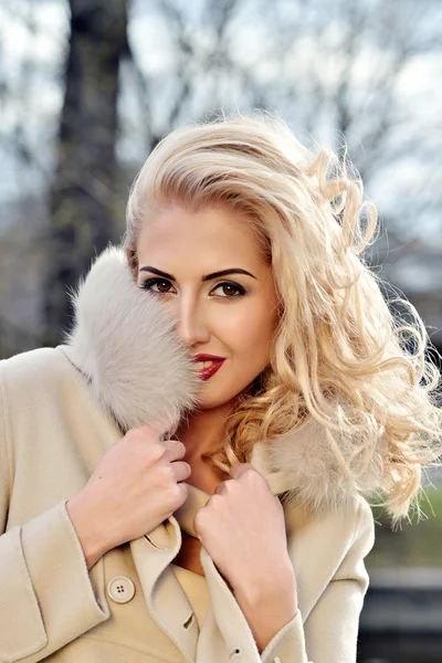 Beautiful blonde girl in coat — Stock Photo, Image