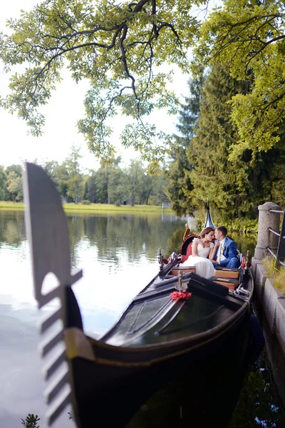 Beautiful bride and groom on gondola — Stock Photo, Image