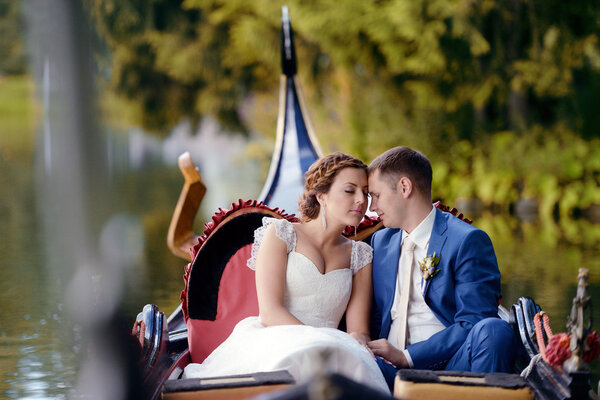 Beautiful bride and groom on gondola