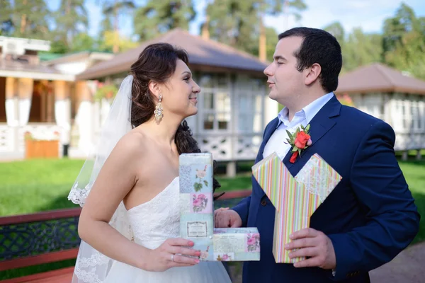 Beautiful wedding couple holding letters — Stock Photo, Image