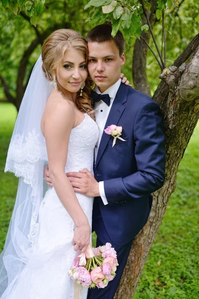 Beautiful bride and groom in park