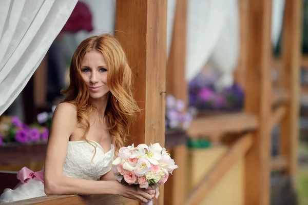 Beauty bride with bouquet — Stock Photo, Image