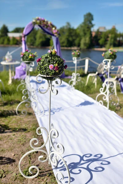 purple wedding arch with flowers