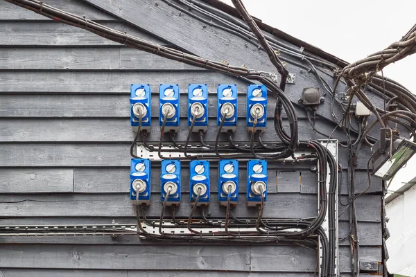 Outdoor power sockets with plugs in at Camden Market in London