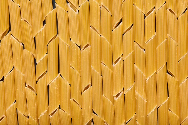 Texture of raw macaroni — Stock Photo, Image