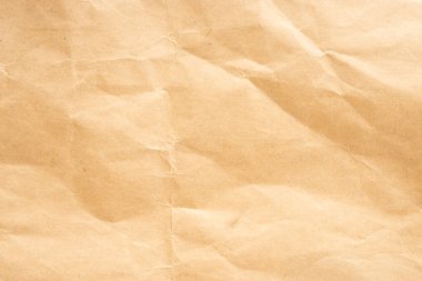 El işi kağıdı. Buruşmuş kahverengi karton kağıt dokusu. Eski buruşmuş geri dönüşümlü kağıt doku, renk bej. Kahverengi arkaplan