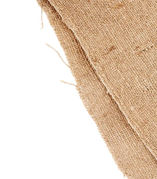 Brown burlap laying on white sheet. Abstract background. Texture of