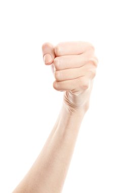 Kadın eli beyaz arka planda izole edilmiş. Beyaz kadının elinde semboller ve jestler var. Yumruk