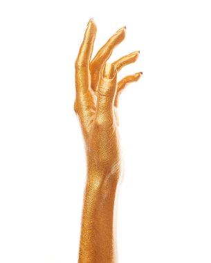 Altın boyalı eller. Altın parmaklar. Kadın eli beyaz arka planda izole edilmiş. Beyaz kadının elinde semboller ve jestler var..