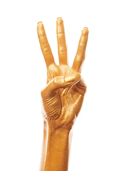 金泥の手 黄金の指 女性の手は白い背景に孤立した数を示している 手話だ 手札番号 — ストック写真