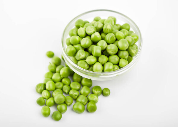 Fresh green pea pod with beans isolated on white background.