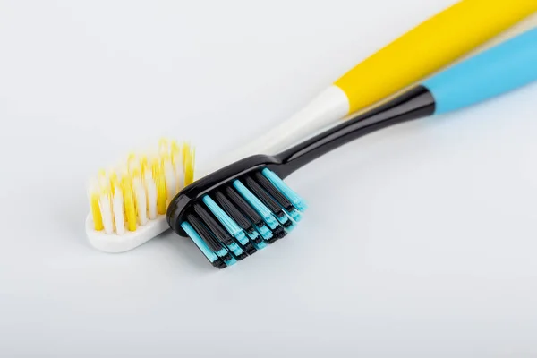 Blue Black White Yellow Toothbrush White Background Oral Health Personal — Stock Photo, Image