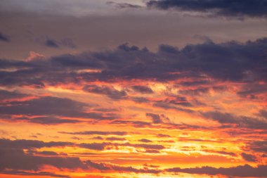 Sunset or sunrise sky with a vibrant gradient of orange, gold, and soft blue. Clear atmosphere with wispy clouds. Peaceful, natural light background. hope, freedom, new day and inspirational Concepts