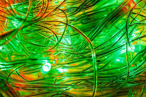 Kerst Lichtgevende Slinger Verschillende Kleuren Het Donker Kerst Textuur Voor — Stockfoto