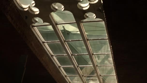 Big old window with a patterned wooden frame in the chapel of church — Stock Video