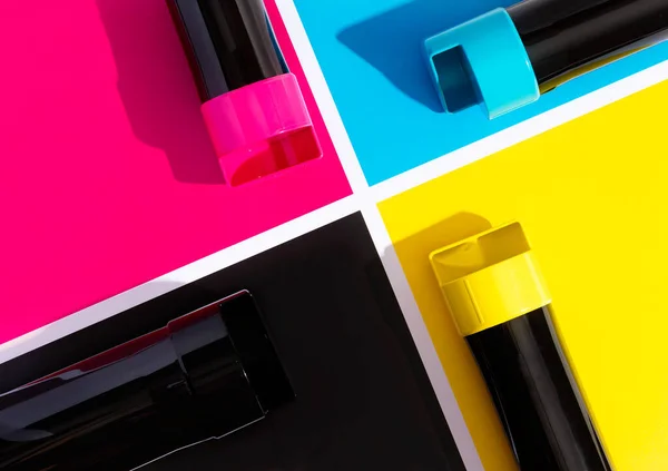 A set of toner cartridges for a color laser printer on the background of SMYK. bright creative concept minimal