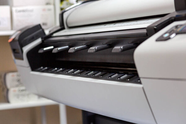 A large plotter on a drawing, suitable for technical and engineering projects