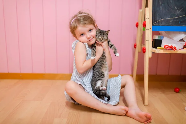 Pretty Caucasian Little Girl Fair Hair Blue Dress Sits Baby — Stock Photo, Image