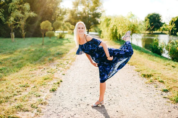 Beautiful caucasian model posing like ballerina outdoor