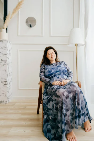 Cheerful Caucasian Woman Dark Hair Long Blue Dress Poses Camera — Stock fotografie