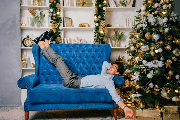 Happy Smiling Man Elegant Clothes Lying Blue Sofa Christmas Tree — Stock Photo, Image