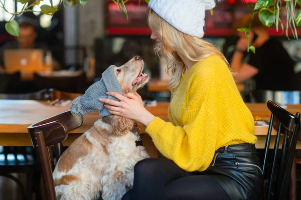 Positive Smiling Happy Blonde Girl Yellow Sweater White Hat Hugs — Stock Photo, Image
