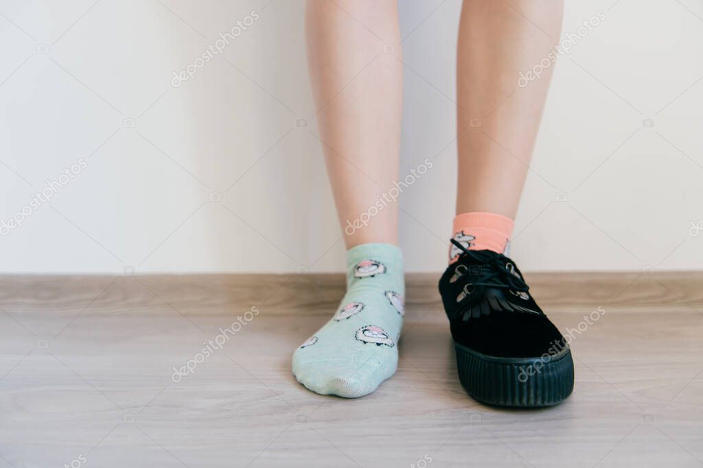 Beautiful Female Foot In Sock Other Women S Leg In Black Suede Shoe With Tankette Weird Strange Kinky Odd Bizarre Concept Inattentive Eccentric Missmatched Clothes Different Pair Of Socks 441404844 Larastock