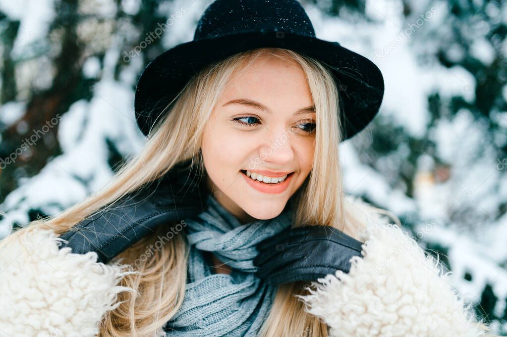 Portrait of pretty stylish smiling blonde girl